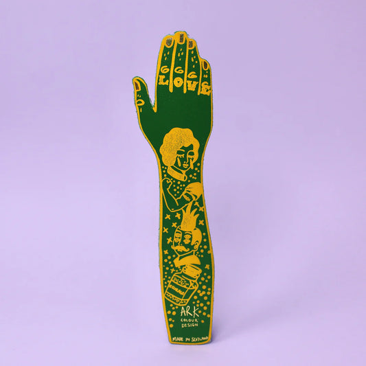 Green leather tattooed arm bookmark on a lilac background
