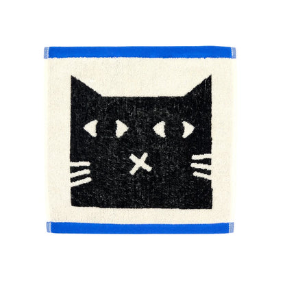 Cream face cloth with a black cat face and blue edges