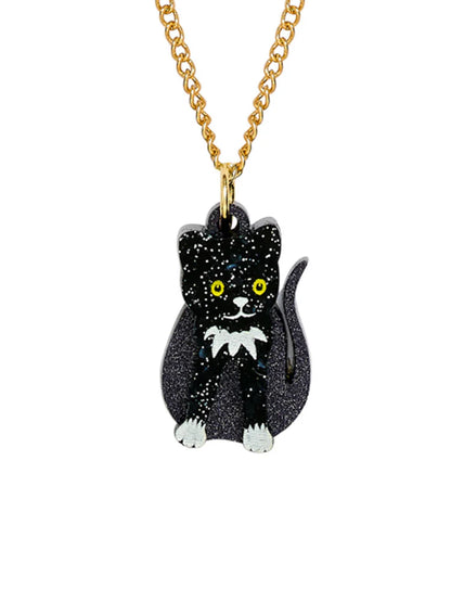 Tatty Devine toy cat pendant: a black glitter cat with yellow eyes on a gold chain