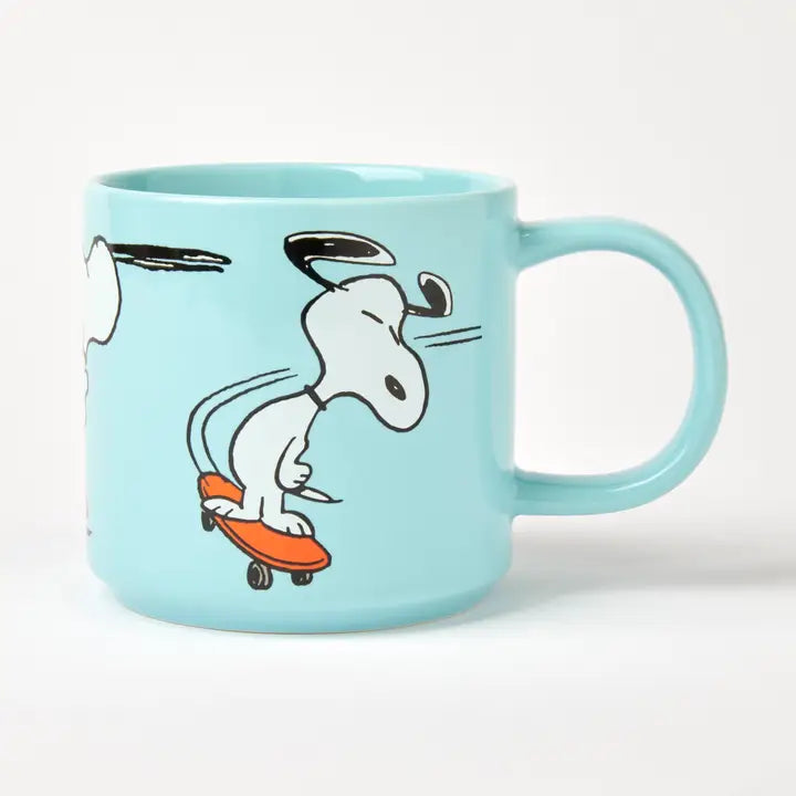 Peanuts skateboard mug: Snoopy skateboarding on pale aqua