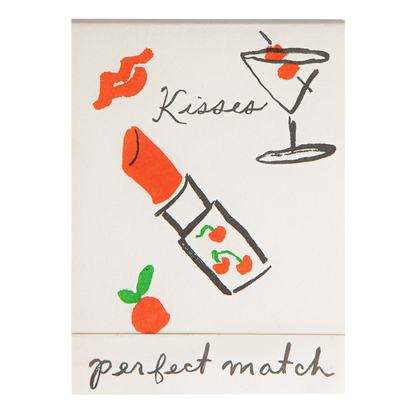 Match book cover: a lipstick, lips and a cocktail: Kisses, perfect match