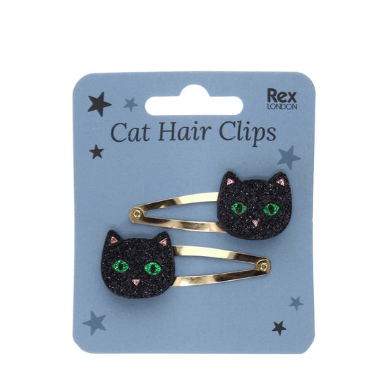 Two glittery black cat hair clips on a blue card: Cat hair clips