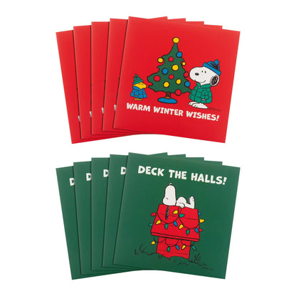 The multipack's red and green Snoopy Christmas cards fanned out