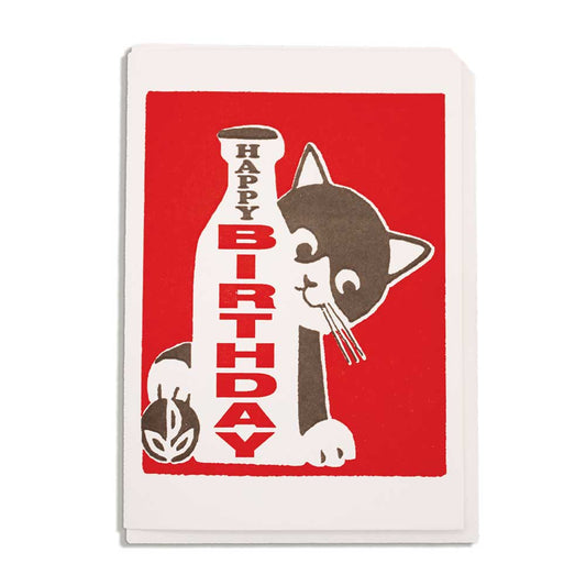 Red letterpress mini card with a black and white cat beside a milk bottle: Happy birthday