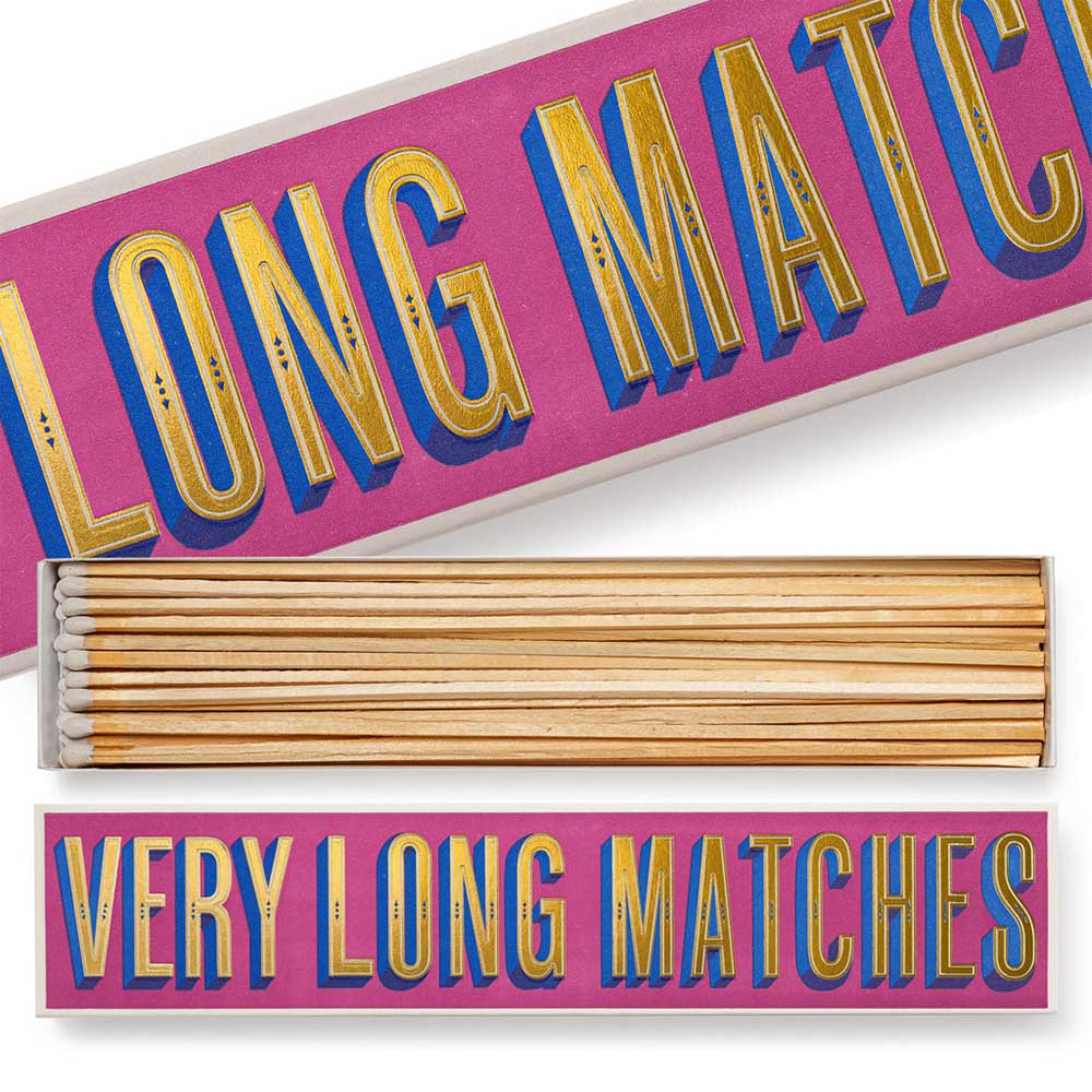 Very long matches box in pink and gold, open to show the matches
