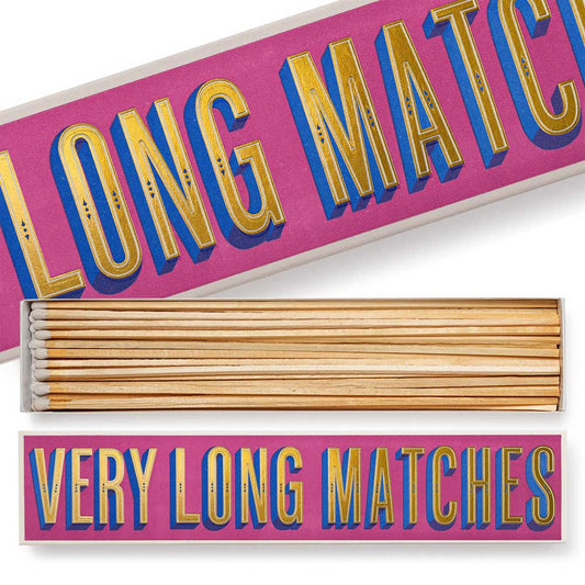 Very long matches box in pink and gold, open to show the matches