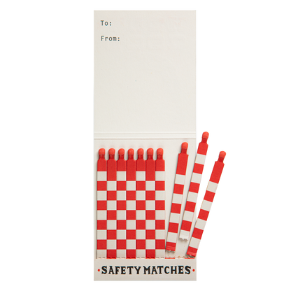 Inside the Good Luck match book with red and white matches and a To/From space