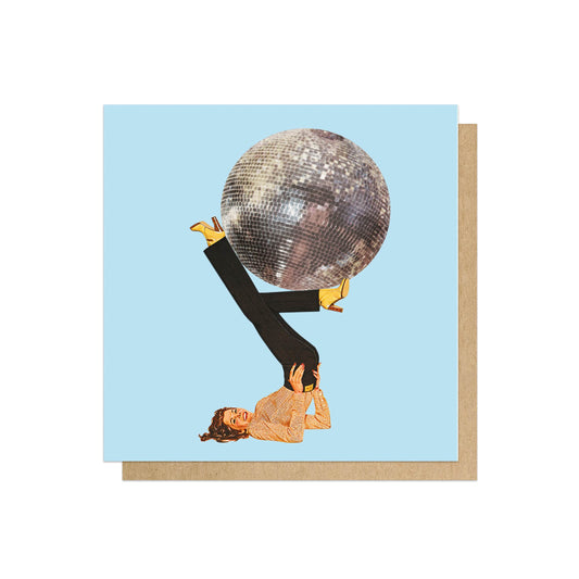 Card with a woman doing a shoulder stand with a disco ball for a head on a blue background