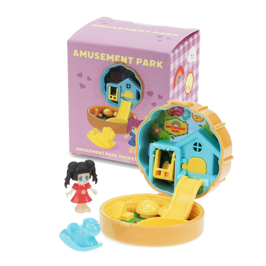 Amusement Park compact playset with a figure beside its box