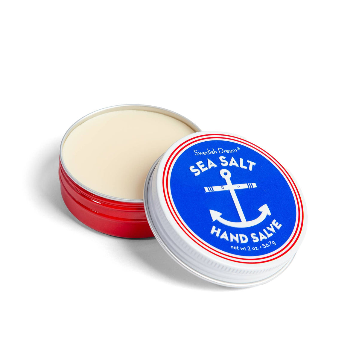 Open red tin of Swedish Dream sea salt hand salve with an anchor lid