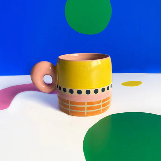 Bloc chunky mug in yellow, pink and orange with dots and a ring handle