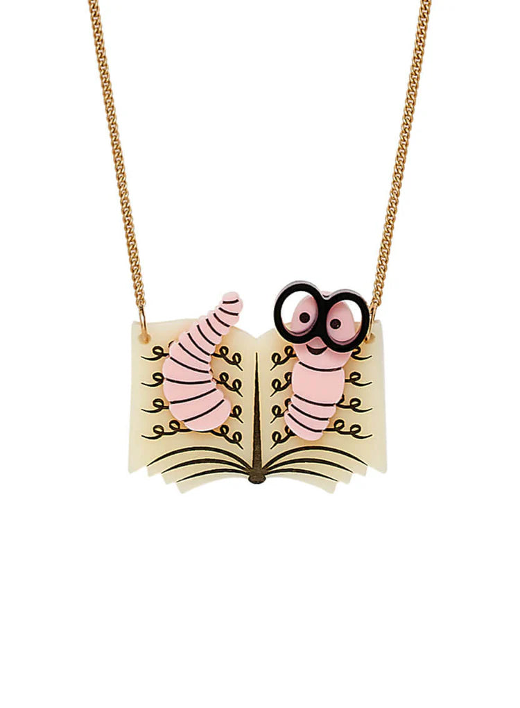 Necklace of a pink bookworm with big eyes reading an open book