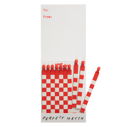 Cowgirl match book open with a few red and white matches pulled out