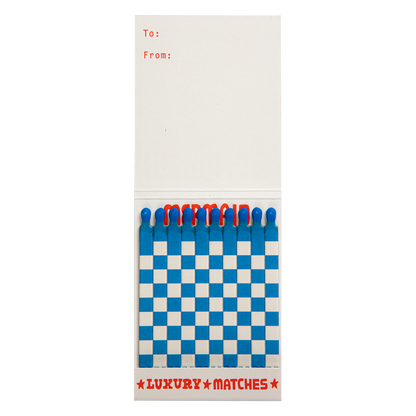 Inside the Mermaid match book with blue and white matches and a To/From space