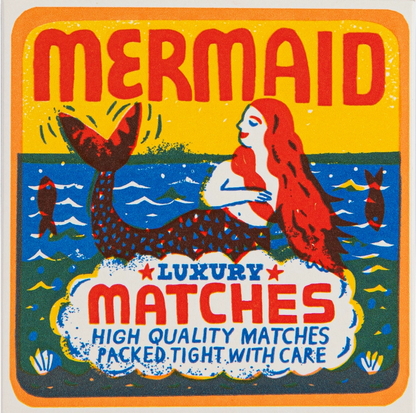 Archivist Mermaid matchbox: a red-haired mermaid on the waves, with 'Luxury matches – high quality matches packed tight with care'