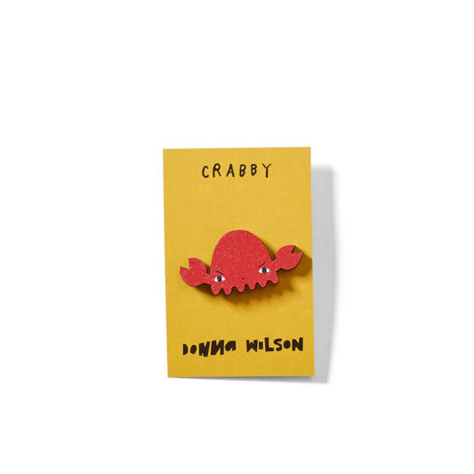 Red crab enamel pin badge on a yellow card: Crabby