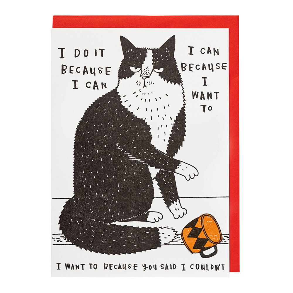 Archivist letterpress card: a grumpy black and white cat beside a knocked-over mug, captioned 'I do it because I can, because I want to'