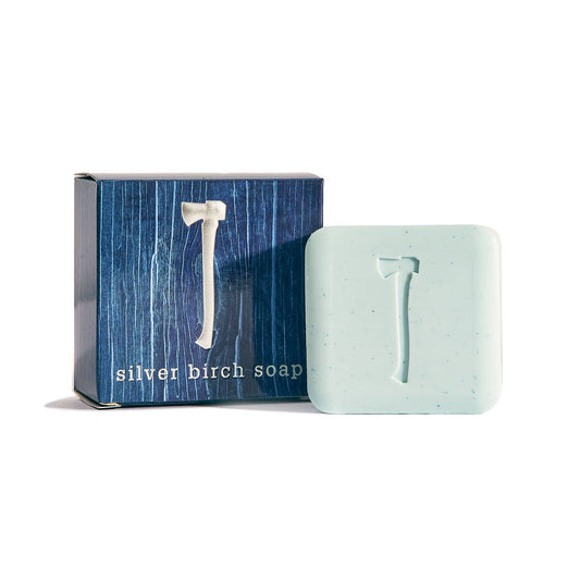 Kalastyle silver birch soap bar stamped with an axe beside its blue box