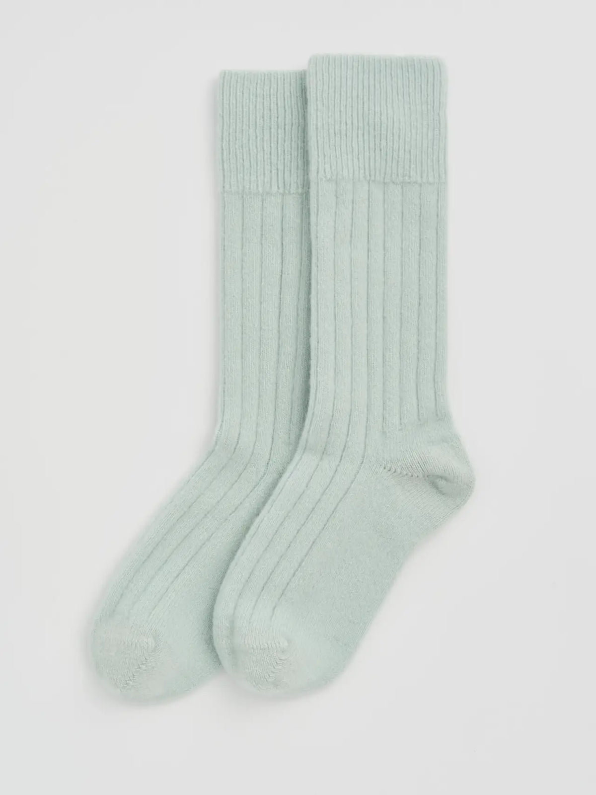Pair of winter mint ribbed bed socks laid flat