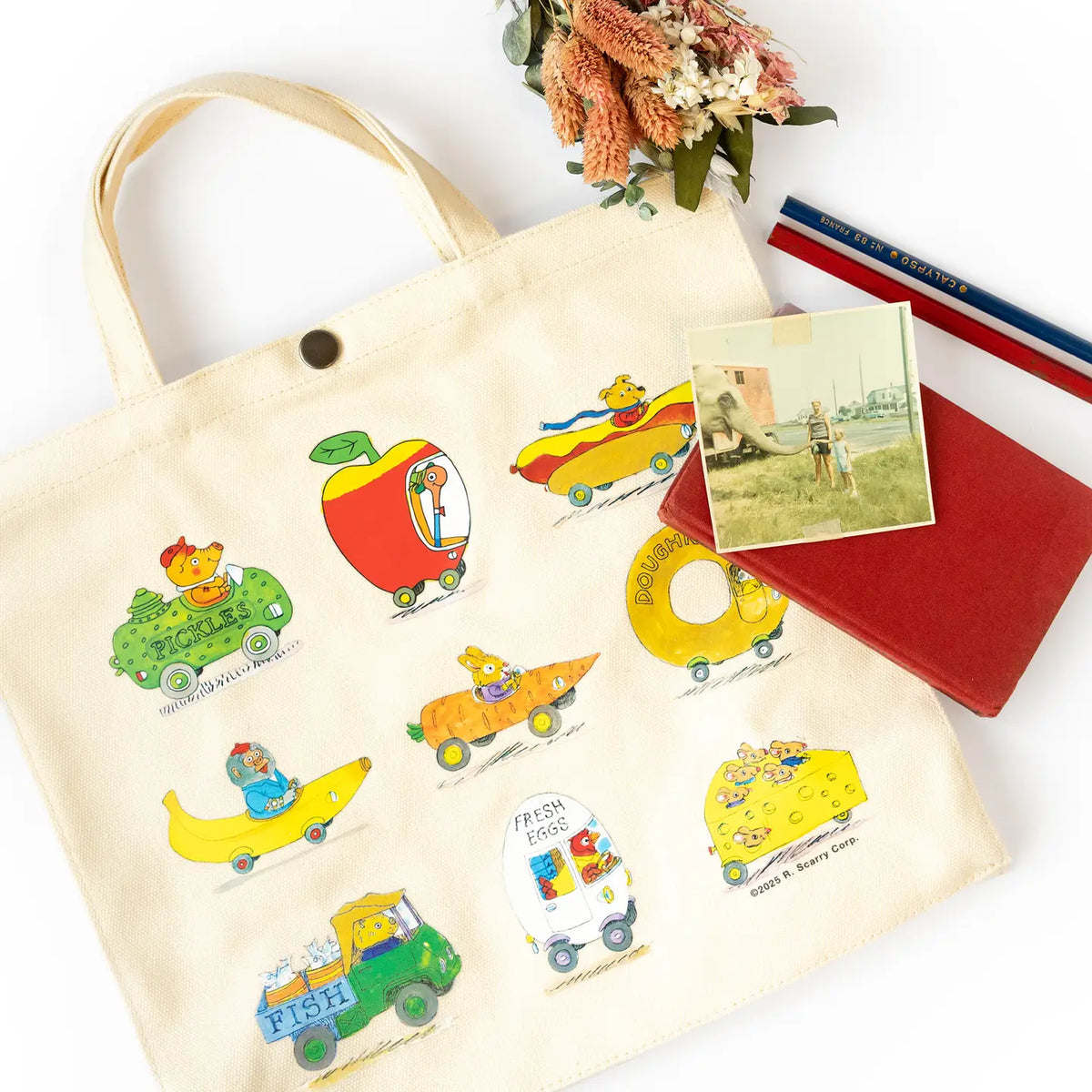 Busytown canvas bag with a notebook, postcard and flowers