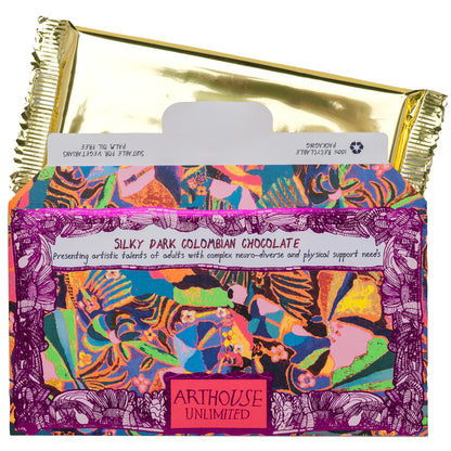 Psychedelia chocolate bar half out of its sleeve, showing the gold foil