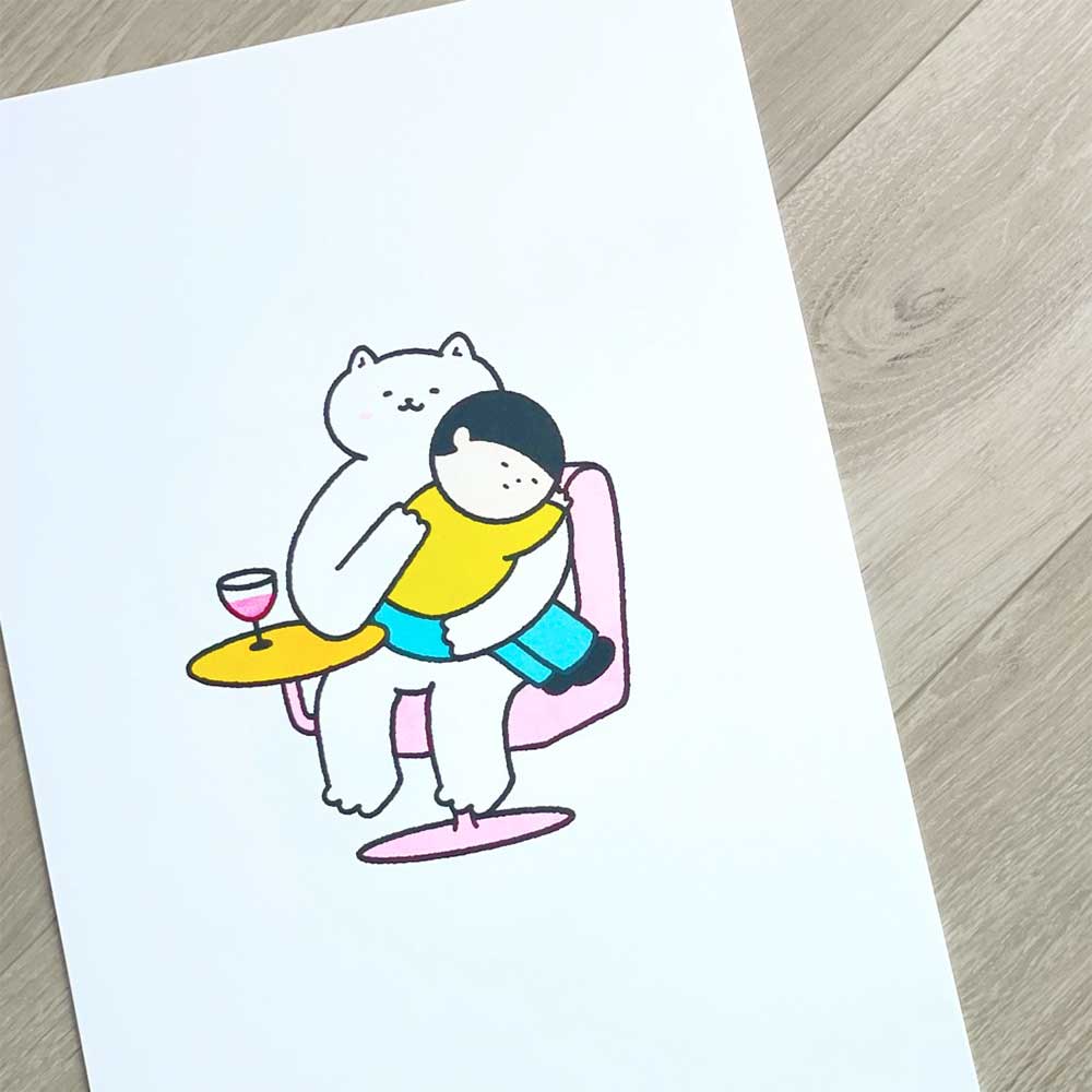 Print of a white cat hugging a person in a pink chair beside a glass of wine
