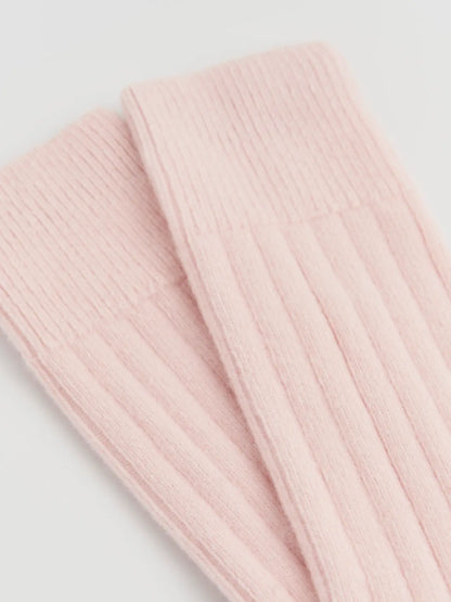 Close-up of the ribbed frosting pink merino knit