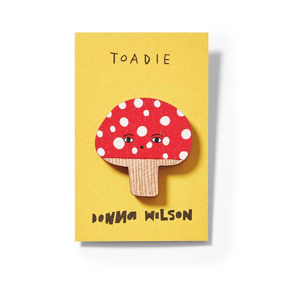 Close-up of the Toadie toadstool pin badge