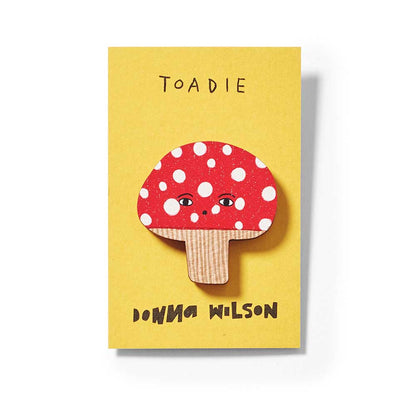 Close-up of the Toadie toadstool pin badge