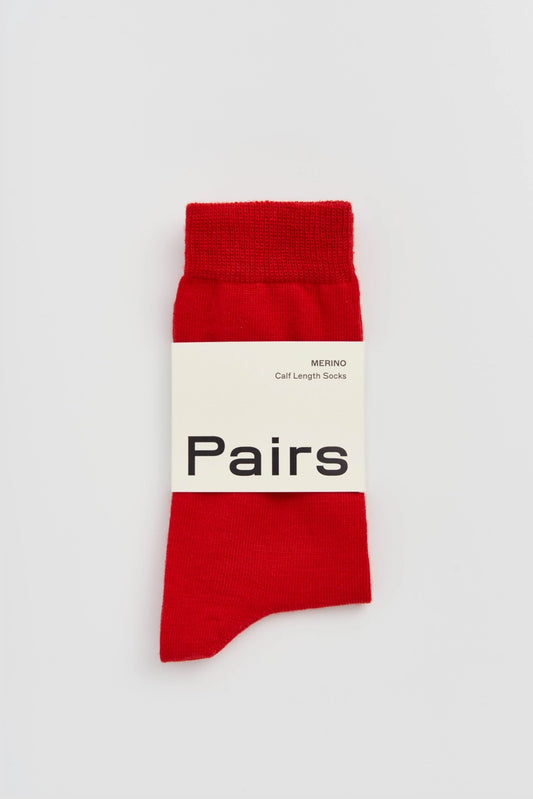 Pairs merino calf socks in postbox red, medium, with a Pairs paper band