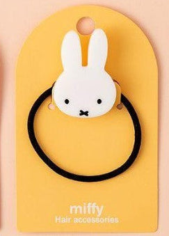 White Miffy hair tie on a yellow backing card