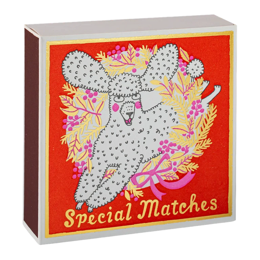 Archivist Christmas matches: a white poodle with a wreath and 'Special matches'