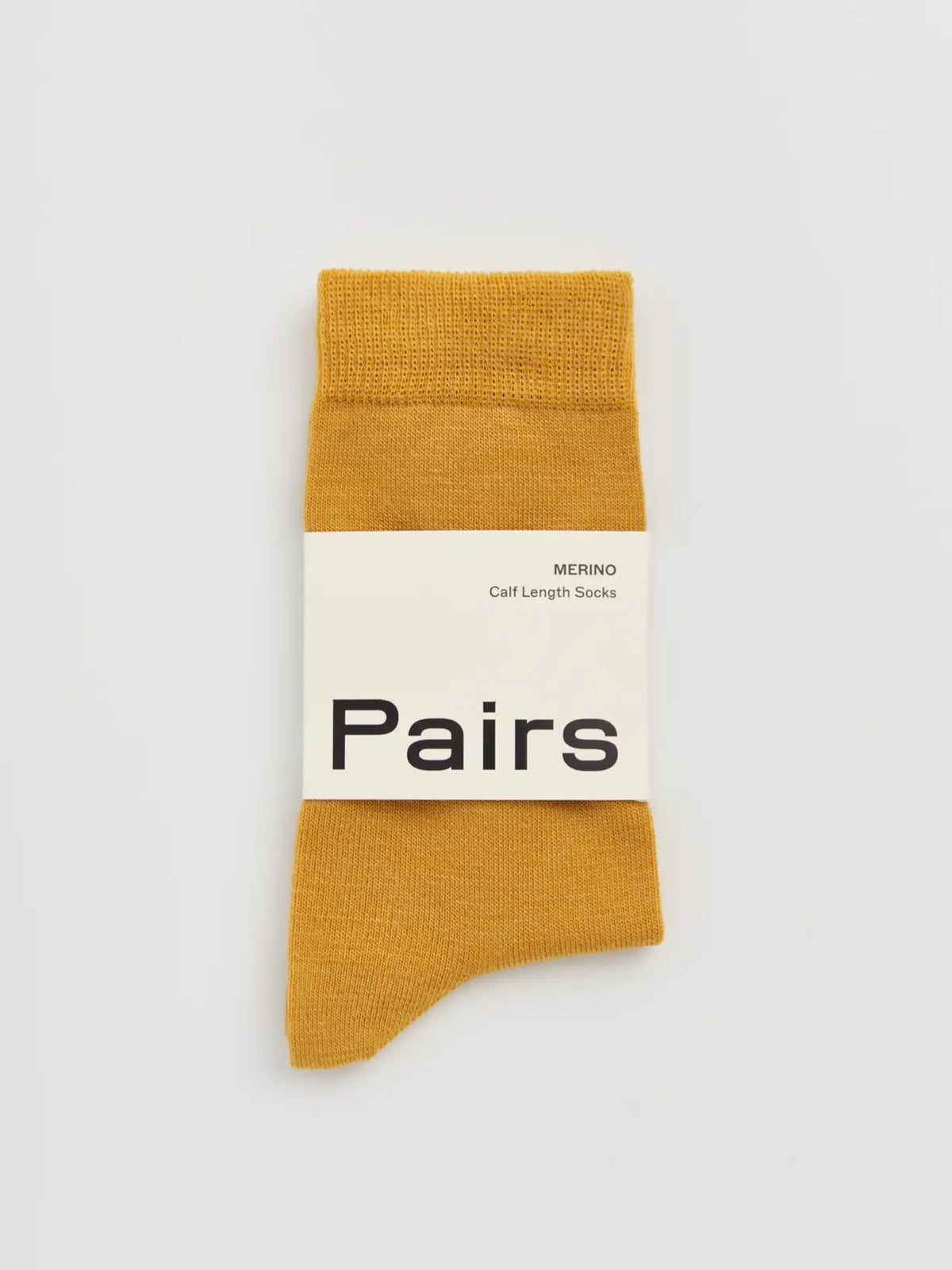 Pairs merino calf socks in golden yellow, medium, with a Pairs paper band