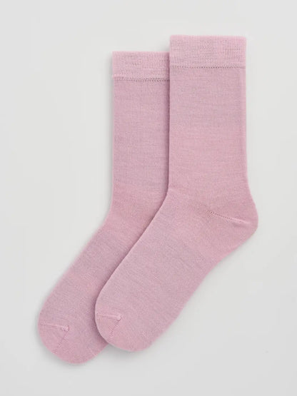 Pair of sugar pink calf-length merino socks laid flat