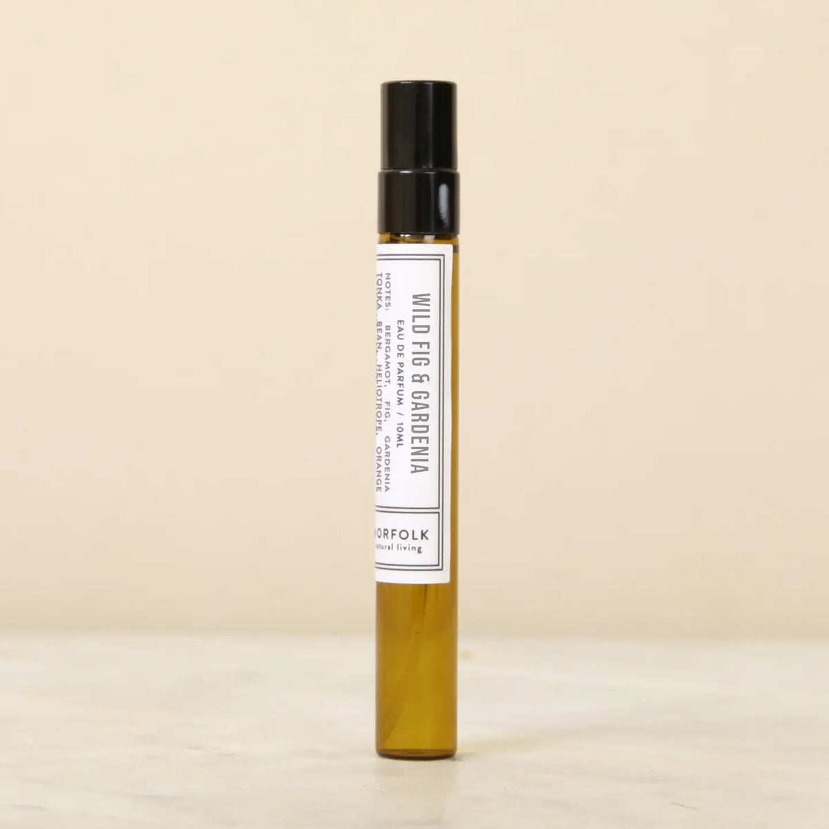 Norfolk Natural Living Wild Fig & Gardenia perfume: a slim amber glass 10ml spray bottle