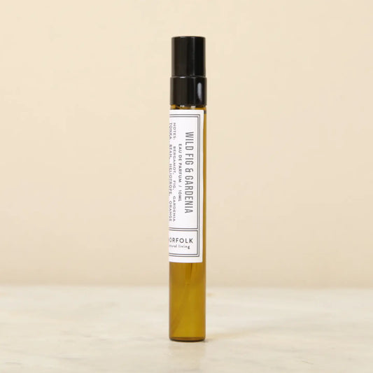 Norfolk Natural Living Wild Fig & Gardenia perfume: a slim amber glass 10ml spray bottle