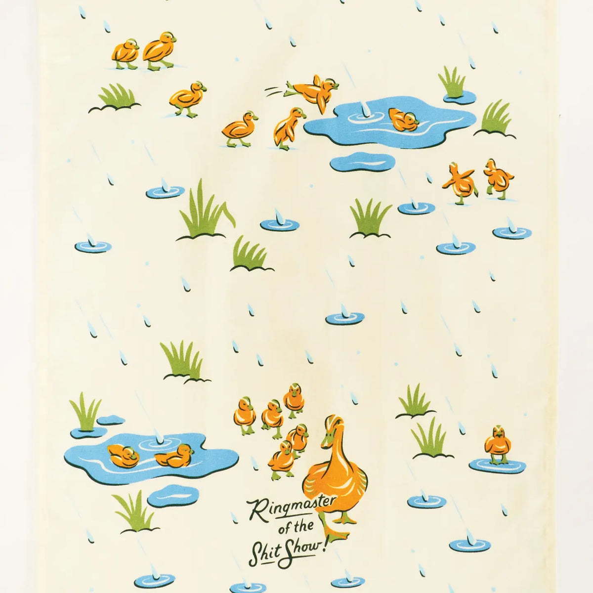 Unfolded Ringmaster tea towel with ducklings splashing in puddles