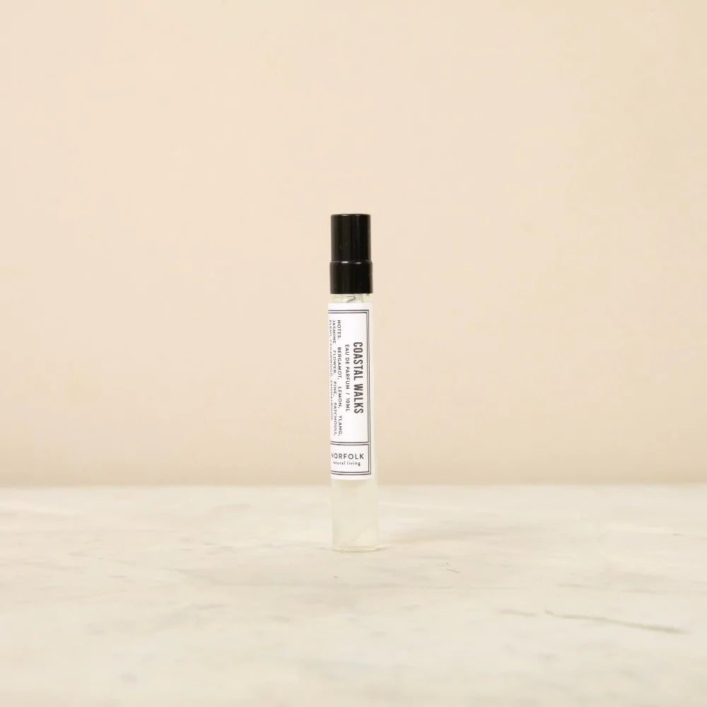 Norfolk Natural Living Coastal Walks eau de parfum: a slim glass spray bottle with a black cap and white label