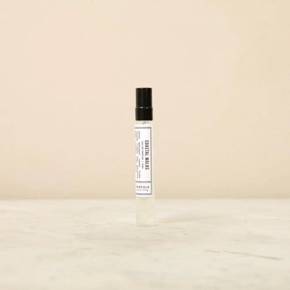 Norfolk Natural Living Coastal Walks eau de parfum: a slim glass spray bottle with a black cap and white label