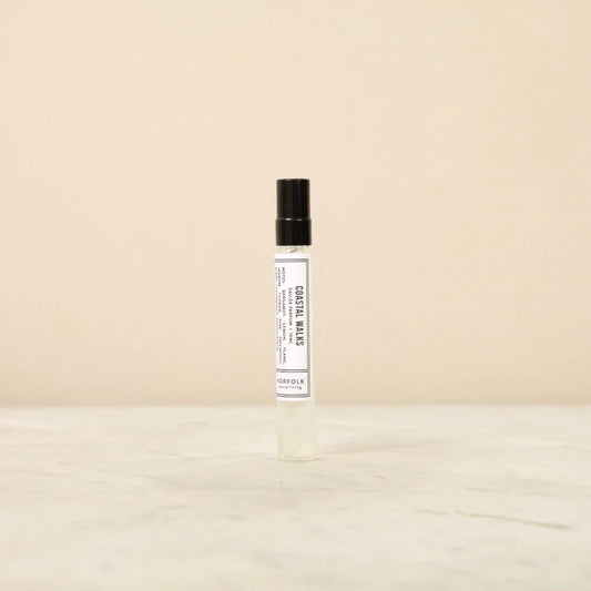Norfolk Natural Living Coastal Walks eau de parfum: a slim glass spray bottle with a black cap and white label