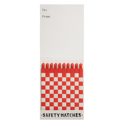 Good Luck match book open with a few red and white matches pulled out