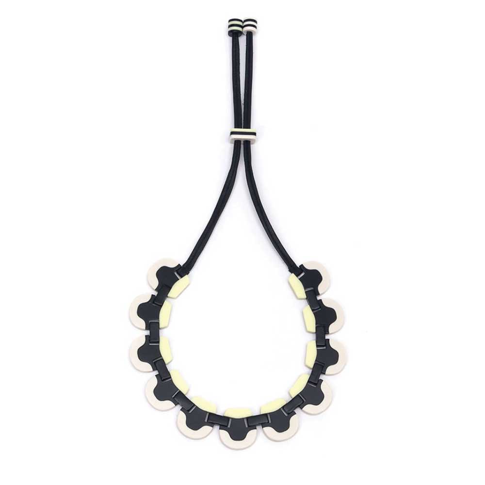 Wave necklace hanging open on its cord