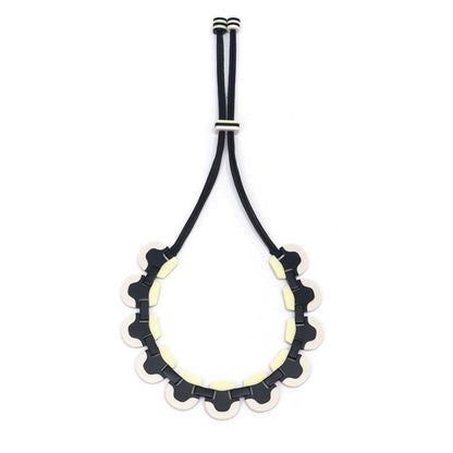 Wave necklace hanging open on its cord