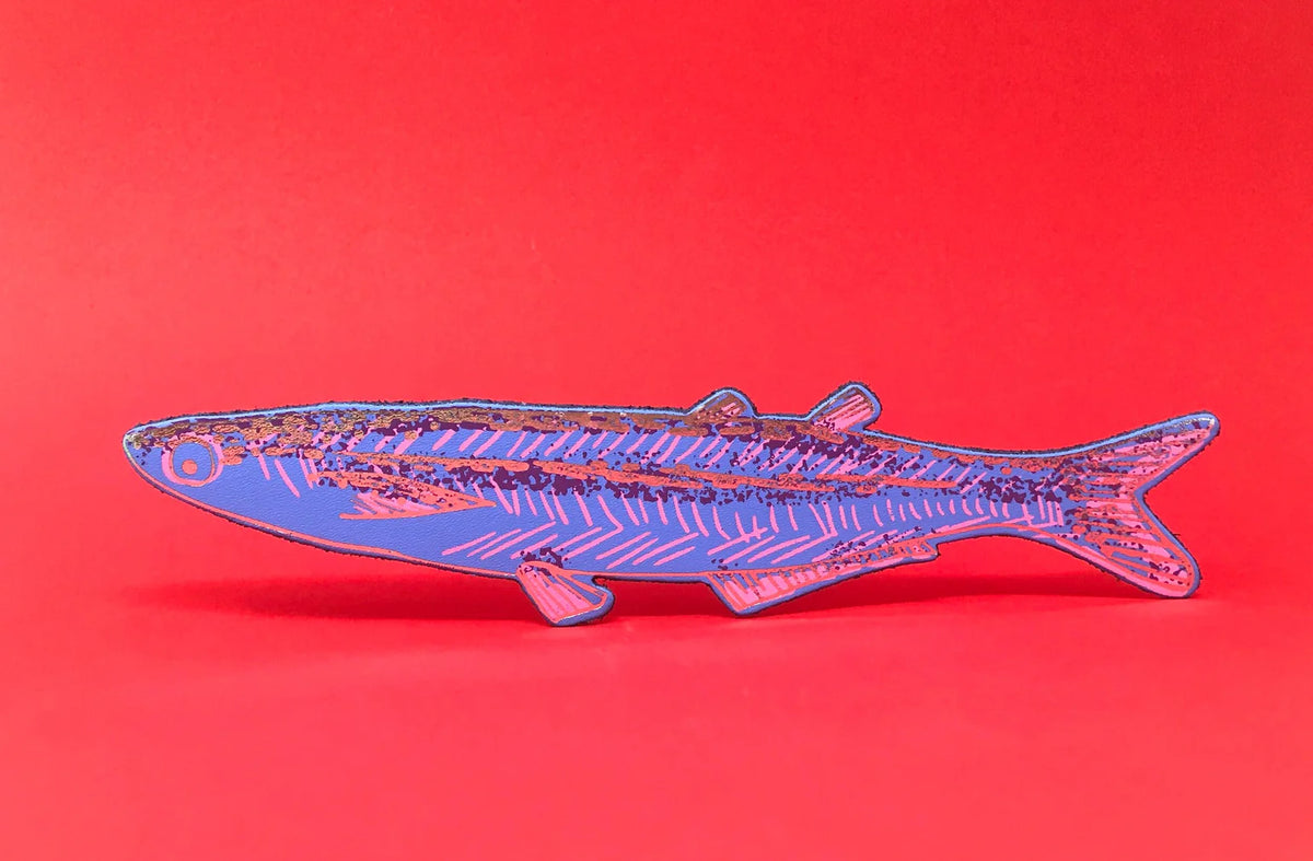 Blue leather sardine bookmark on a red background