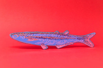 Blue leather sardine bookmark on a red background