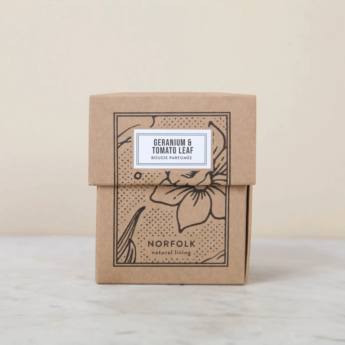 Geranium & Tomato Leaf candle box: kraft card with a black floral print and white label