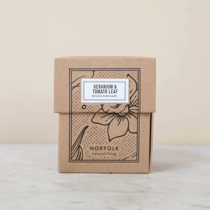 Geranium & Tomato Leaf candle box: kraft card with a black floral print and white label