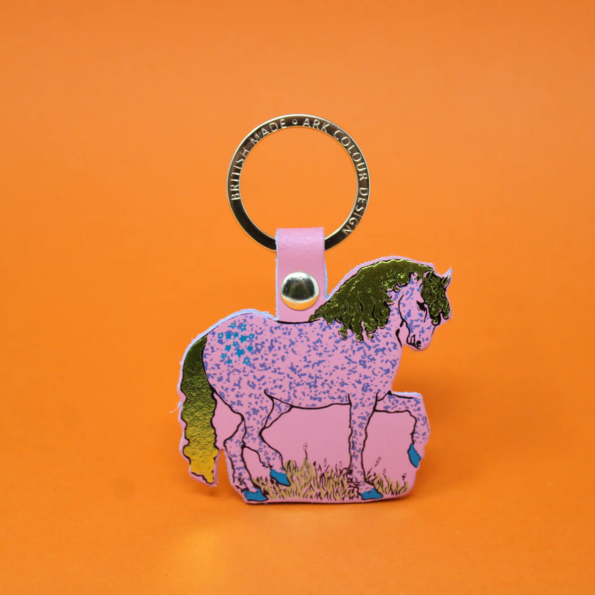 Pale pink leather horse key fob with a speckled pattern and green mane