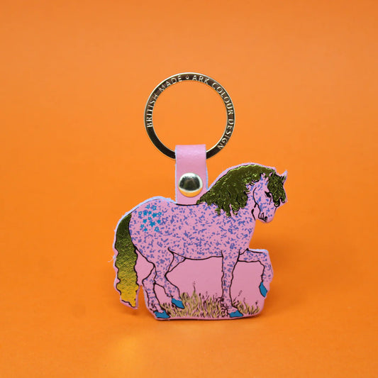 Pale pink leather horse key fob with a speckled pattern and green mane