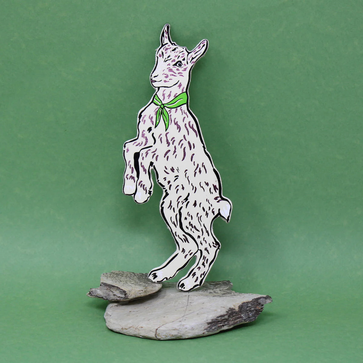 Ark cream goat bookmark with a green neckerchief, standing on a rock